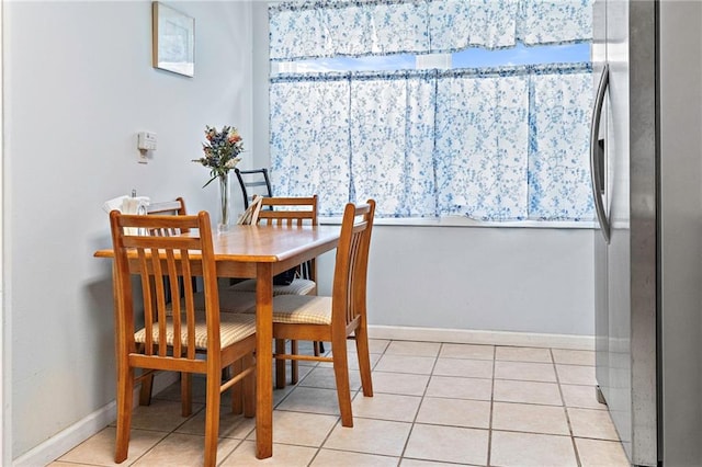 3513 Haring Rd, Metairie, LA 70006 - dining area with baseboards and light tile patterned floors