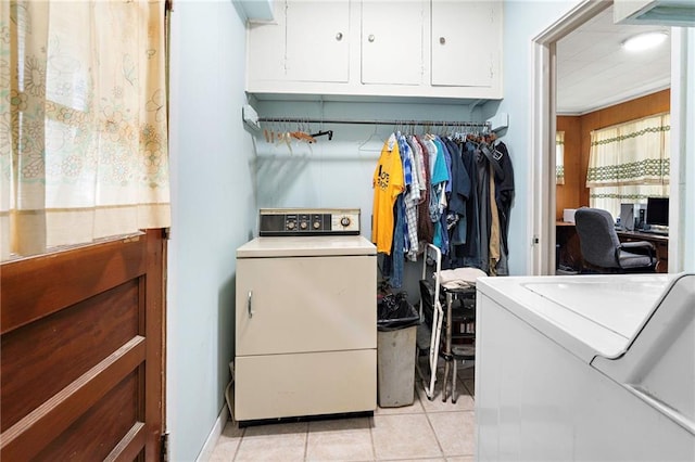 3513 Haring Rd, Metairie, LA 70006 - laundry area featuring cabinet space, light tile patterned flooring, and an office area