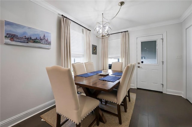 6208 Lafreniere St, Metairie, LA 70003 - dining space with a chandelier, crown molding, dark wood-type flooring, and baseboards