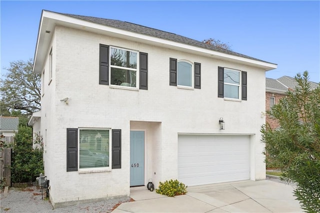 450 Carrollton Ave, Metairie, LA 70005 - view of front of house featuring concrete driveway and a garage