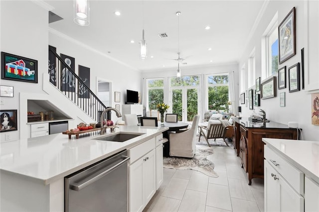 450 Carrollton Ave, Metairie, LA 70005 - kitchen with stainless steel dishwasher, open floor plan, light countertops, recessed lighting, and ornamental molding