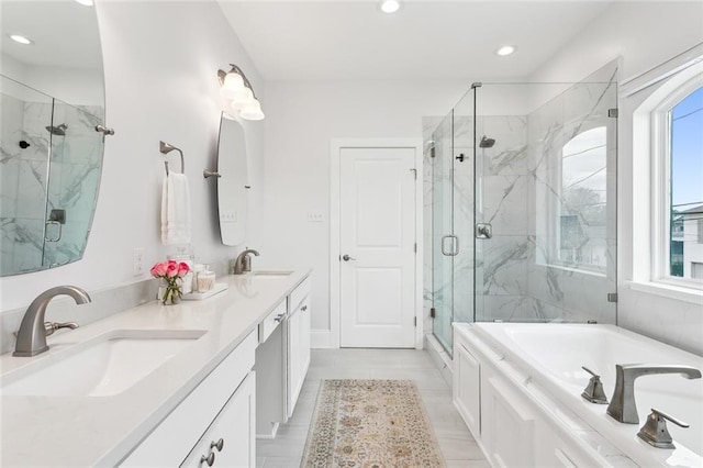 450 Carrollton Ave, Metairie, LA 70005 - bathroom featuring a garden tub, a marble finish shower, double vanity, and recessed lighting