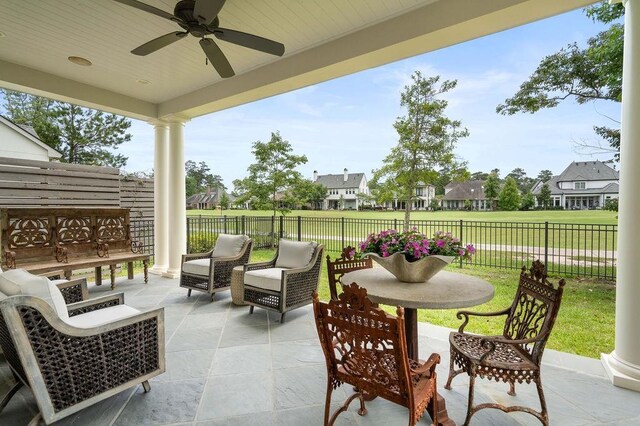 65 Hummingbird Rd, Covington, LA 70433 - fenced backyard featuring a patio area, ceiling fan, a residential view, and an outdoor hangout area