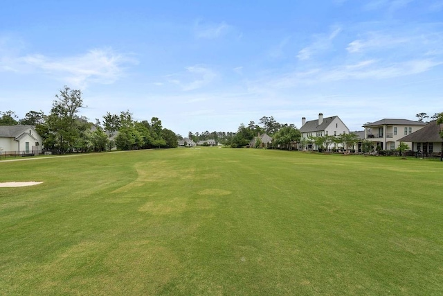 65 Hummingbird Rd, Covington, LA 70433 - view of green lawn featuring view of golf course and a residential view