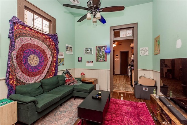 262830 N Rampart St, New Orleans, LA 70117 - living room featuring a ceiling fan, wainscoting, and wood finished floors