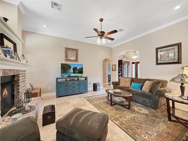 232 Old Mill Loop, Pearl River, LA 70452 - living room featuring arched walkways, crown molding, a ceiling fan, recessed lighting, and a fireplace