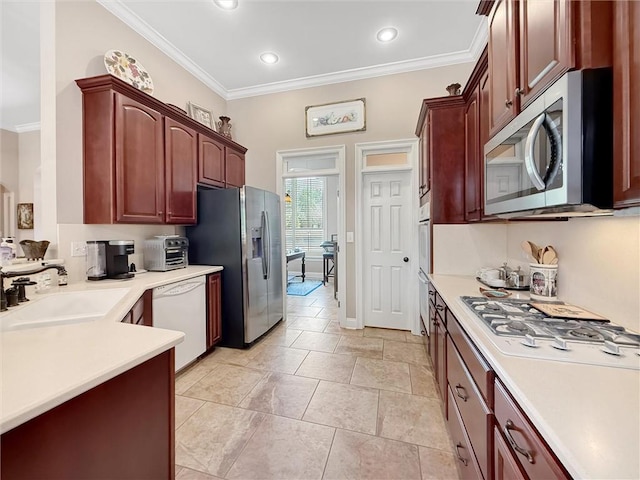 232 Old Mill Loop, Pearl River, LA 70452 - kitchen with appliances with stainless steel finishes, ornamental molding, a sink, reddish brown cabinets, and light countertops