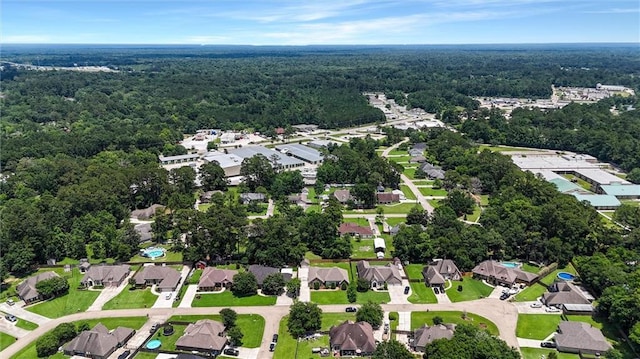 232 Old Mill Loop, Pearl River, LA 70452 - aerial view of property and surrounding area featuring a heavily wooded area and nearby suburban area