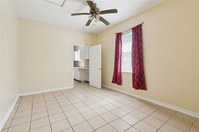 261315 N Prieur St, New Orleans, LA 70117 - unfurnished room featuring a ceiling fan, light tile patterned floors, and baseboards