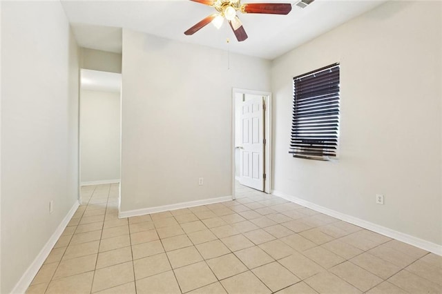 261315 N Prieur St, New Orleans, LA 70117 - spare room featuring a ceiling fan, light tile patterned flooring, and baseboards