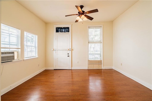 1606 N Broad St, New Orleans, LA 70119 - entrance foyer featuring wood finished floors, cooling unit, a ceiling fan, and baseboards