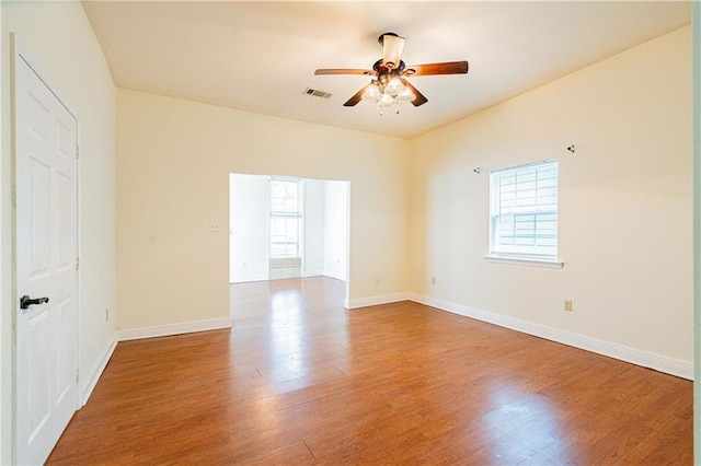 1606 N Broad St, New Orleans, LA 70119 - empty room with a ceiling fan, wood finished floors, and baseboards