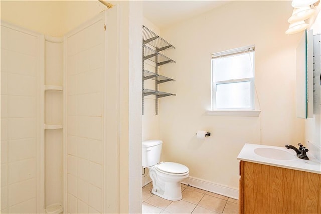 1606 N Broad St, New Orleans, LA 70119 - bathroom featuring vanity, tile patterned flooring, toilet, a shower, and baseboards