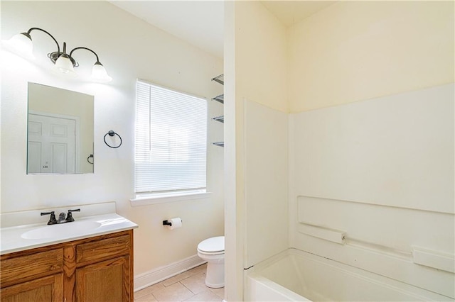 1606 N Broad St, New Orleans, LA 70119 - full bath with vanity, toilet, tile patterned floors, bathing tub / shower combination, and baseboards