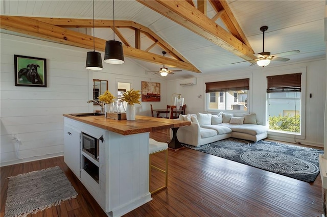 3113 Bayou View Pl, Slidell, LA 70458 - kitchen featuring wood counters, a sink, ceiling fan, and a wall mounted AC