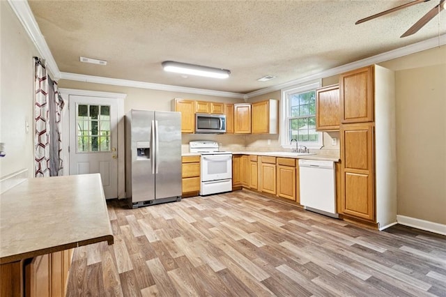 1928 Barbara Dr, Slidell, LA 70458 - kitchen featuring appliances with stainless steel finishes, crown molding, a textured ceiling, light wood-style flooring, and ceiling fan