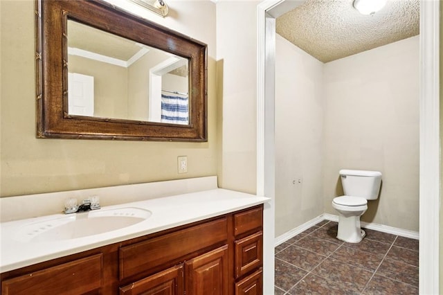 1928 Barbara Dr, Slidell, LA 70458 - full bathroom with toilet, vanity, baseboards, tile patterned floors, and a textured ceiling