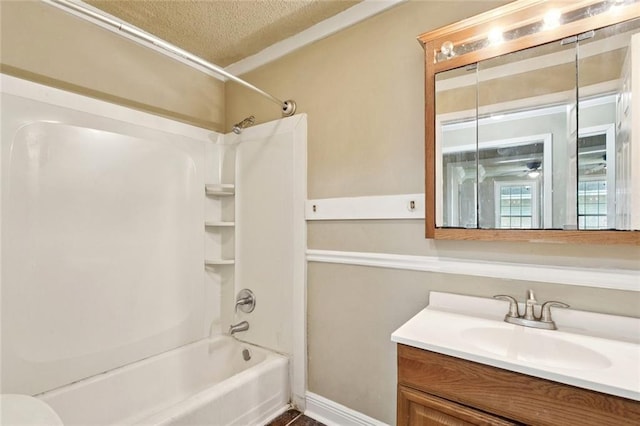 1928 Barbara Dr, Slidell, LA 70458 - bathroom with tub / shower combination, vanity, a textured ceiling, toilet, and baseboards