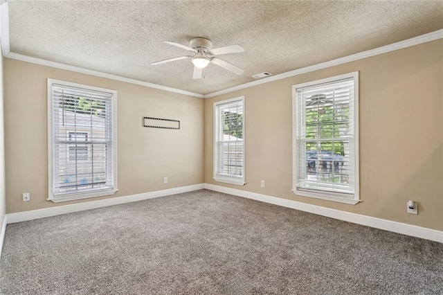 1928 Barbara Dr, Slidell, LA 70458 - carpeted spare room with plenty of natural light, a textured ceiling, ceiling fan, baseboards, and ornamental molding