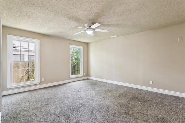 1928 Barbara Dr, Slidell, LA 70458 - carpeted empty room with ceiling fan, baseboards, and a textured ceiling