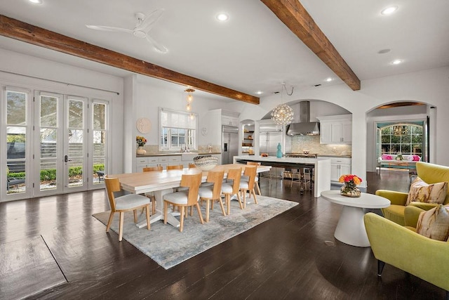 1322 S Jahncke Ave, Covington, LA 70434 - dining space with recessed lighting, beamed ceiling, dark wood-style flooring, arched walkways, and a ceiling fan