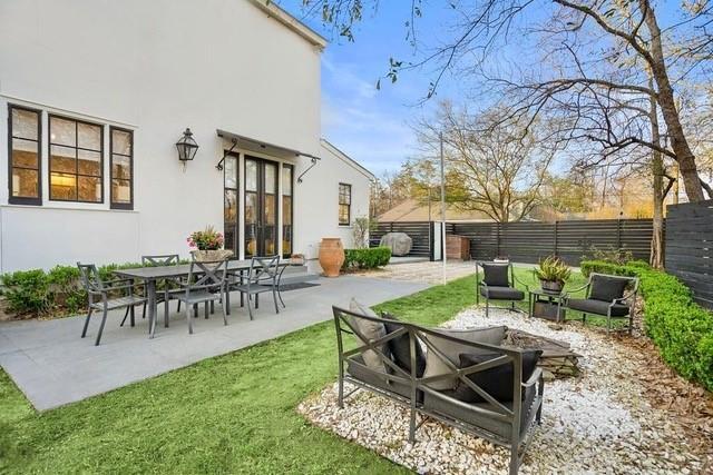 1322 S Jahncke Ave, Covington, LA 70434 - view of yard featuring a fire pit and a patio area