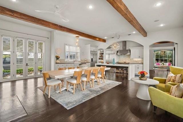 1322 S Jahncke Ave, Covington, LA 70434 - dining room featuring recessed lighting, beam ceiling, arched walkways, dark wood finished floors, and a ceiling fan