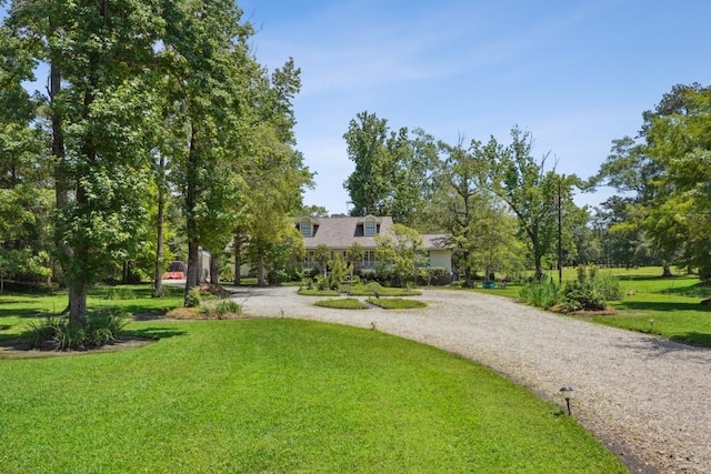 214 Tchefuncte Dr, Covington, LA 70433 - view of property's community featuring curved driveway and a yard