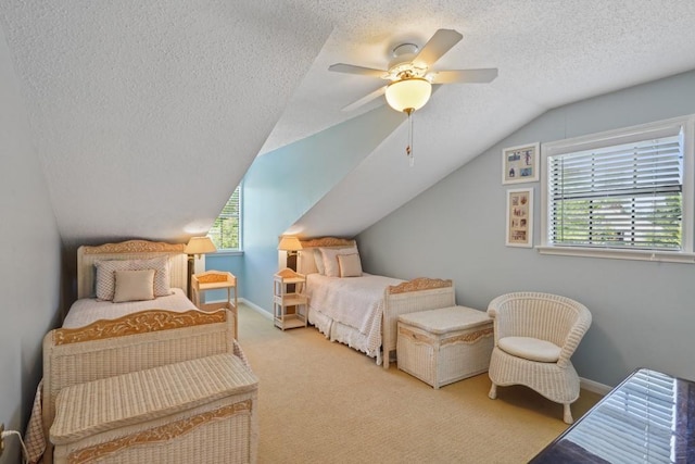 214 Tchefuncte Dr, Covington, LA 70433 - carpeted bedroom featuring a textured ceiling, multiple windows, vaulted ceiling, a ceiling fan, and baseboards