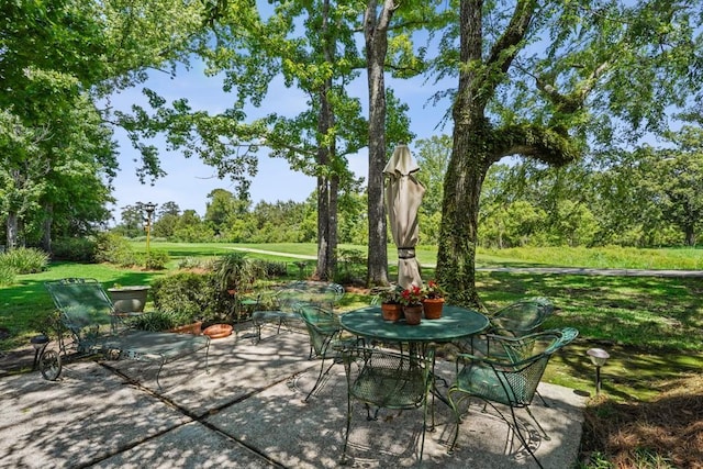 214 Tchefuncte Dr, Covington, LA 70433 - view of patio with view of scattered trees