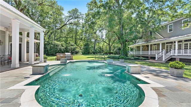 20263 Brunning Rd, Covington, LA 70435 - outdoor pool with a patio area, a wooden deck, and grilling area