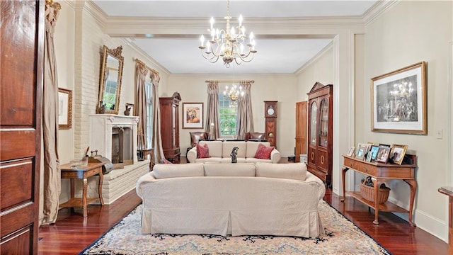 20263 Brunning Rd, Covington, LA 70435 - living area featuring a chandelier, a fireplace with raised hearth, dark wood finished floors, crown molding, and baseboards