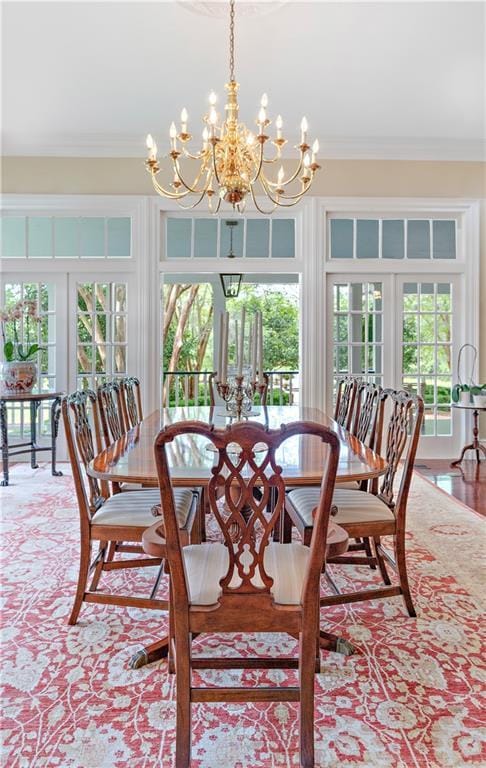 20263 Brunning Rd, Covington, LA 70435 - dining space featuring a chandelier, ornamental molding, healthy amount of natural light, and french doors