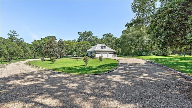 20263 Brunning Rd, Covington, LA 70435 - view of front facade featuring a garage, a front yard, and driveway