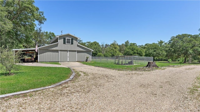 20263 Brunning Rd, Covington, LA 70435 - exterior space featuring a barn, an outdoor structure, a carport, and driveway