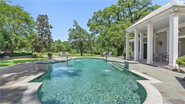 20263 Brunning Rd, Covington, LA 70435 - swimming pool featuring a patio area and view of wooded area