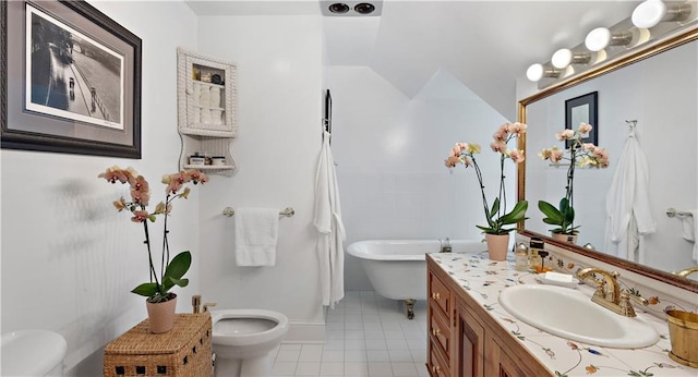 20263 Brunning Rd, Covington, LA 70435 - full bath featuring toilet, vanity, tile patterned floors, and a freestanding bath