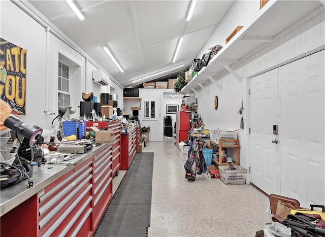 20263 Brunning Rd, Covington, LA 70435 - garage with a workshop area and a wall unit AC
