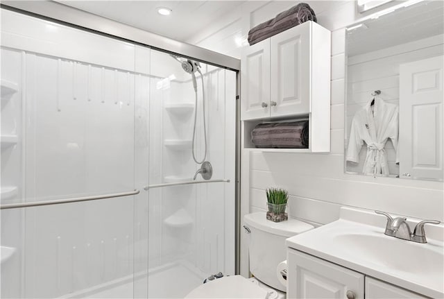 20263 Brunning Rd, Covington, LA 70435 - bathroom with toilet, a shower stall, vanity, and recessed lighting