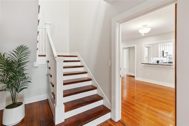 1530 Bordeaux St Unit C, New Orleans, LA 70115 - stairway with wood-type flooring and baseboards
