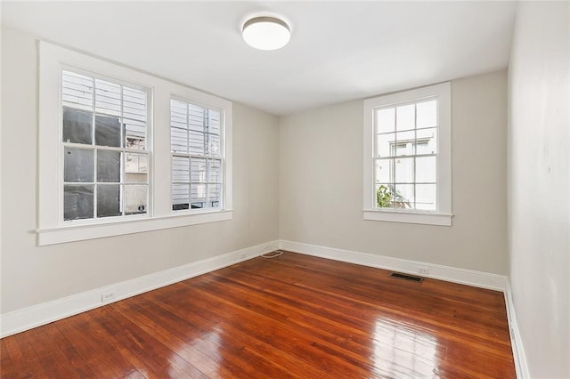1530 Bordeaux St Unit C, New Orleans, LA 70115 - unfurnished room with baseboards and hardwood / wood-style flooring