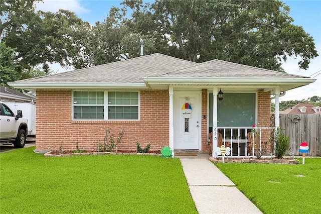 620 Maryland Ave, Metairie, LA 70003 - bungalow with brick siding, a shingled roof, and covered porch
