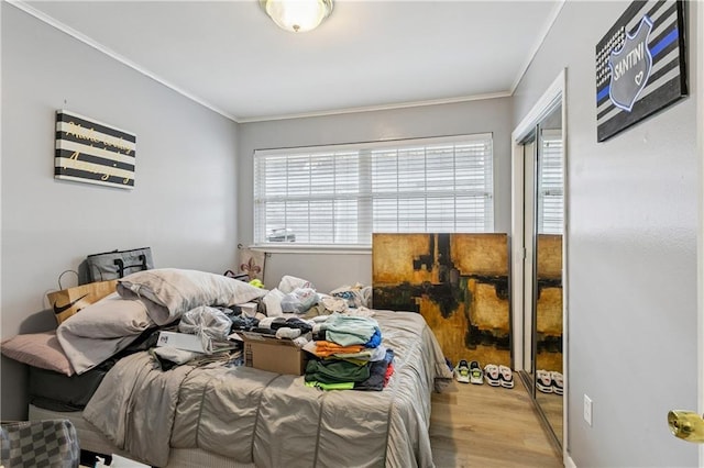 620 Maryland Ave, Metairie, LA 70003 - bedroom featuring wood finished floors, crown molding, and a closet