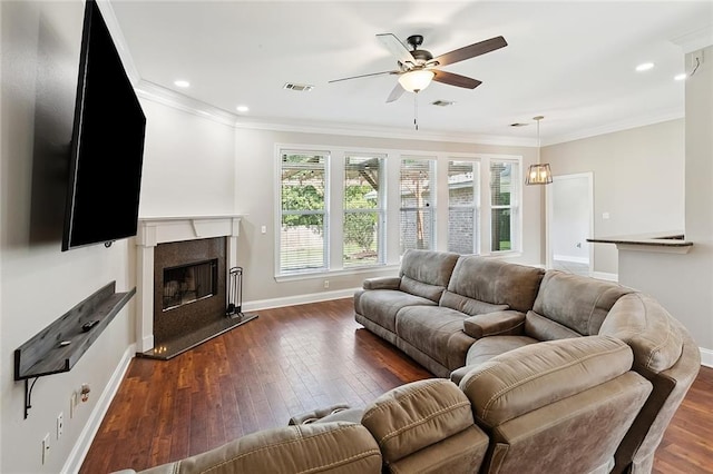 204 Annette Dr, Slidell, LA 70458 - living room with a ceiling fan, dark wood finished floors, baseboards, crown molding, and a fireplace