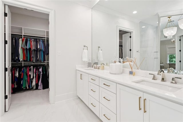 516 N Corniche Du Lac, Covington, LA 70433 - full bath featuring double vanity, a walk in closet, marble look tile flooring, recessed lighting, and baseboards
