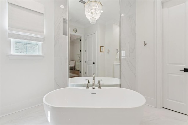 516 N Corniche Du Lac, Covington, LA 70433 - full bath with a freestanding bath, baseboards, and marble finish floors