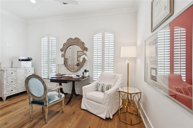 516 N Corniche Du Lac, Covington, LA 70433 - living area featuring wood finished floors, baseboards, ornamental molding, and ceiling fan