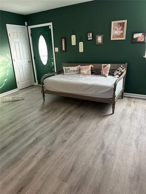 4405 Cartier Ave, New Orleans, LA 70122 - bedroom featuring wood finished floors and baseboards