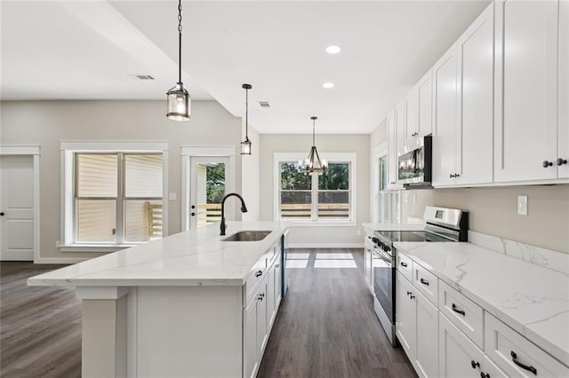 4251 Poplar Dr, Slidell, LA 70461 - kitchen featuring appliances with stainless steel finishes, a sink, dark wood-type flooring, an island with sink, and recessed lighting