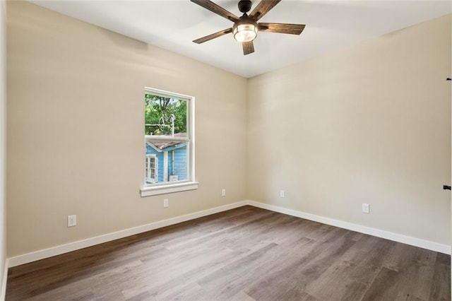 4251 Poplar Dr, Slidell, LA 70461 - unfurnished room with dark wood finished floors, a ceiling fan, and baseboards